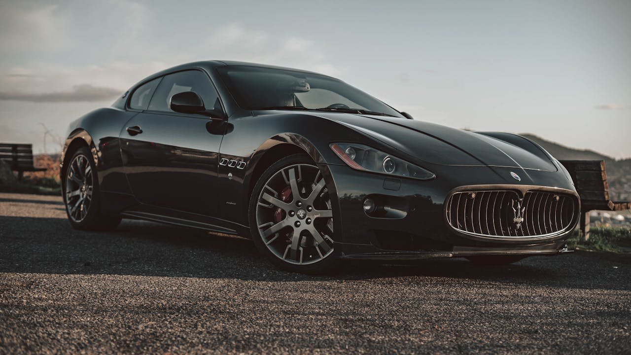 Black Car Parked on Gray Asphalt Road